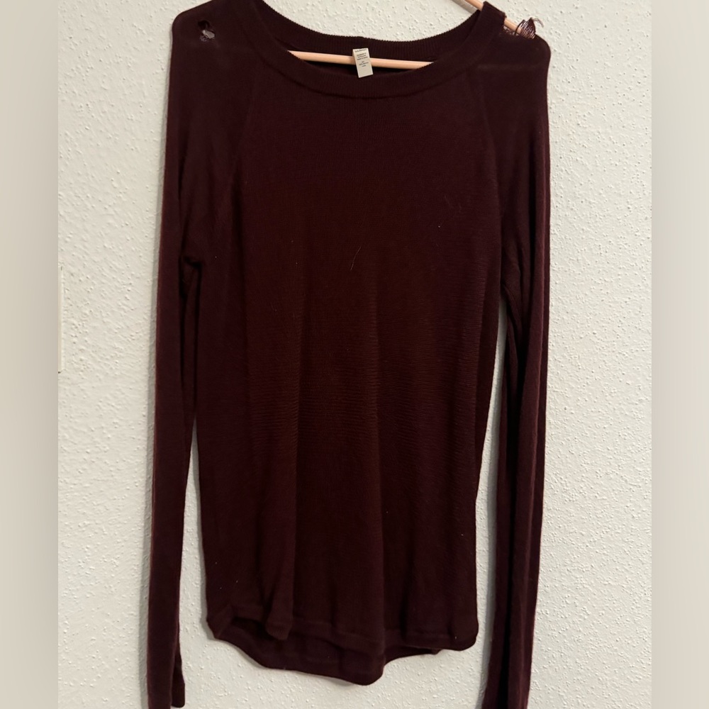 Worn once and several holes from washing it. Repairable! Merino wool